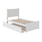 Letto a piattaforma in legno massiccio con pediera e letto estraibile abbinati