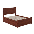 Letto a piattaforma in legno massiccio con pediera e letto estraibile abbinati
